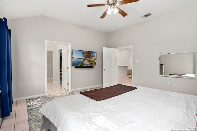 bedroom featuring a ceiling fan, visible vents, light tile patterned floors, baseboards, and lofted ceiling
