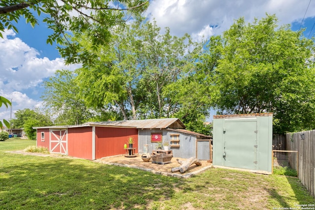 view of outbuilding with a fenced backyard and an outdoor structure