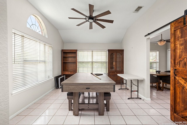 interior space featuring baseboards, ceiling fan, visible vents, and lofted ceiling