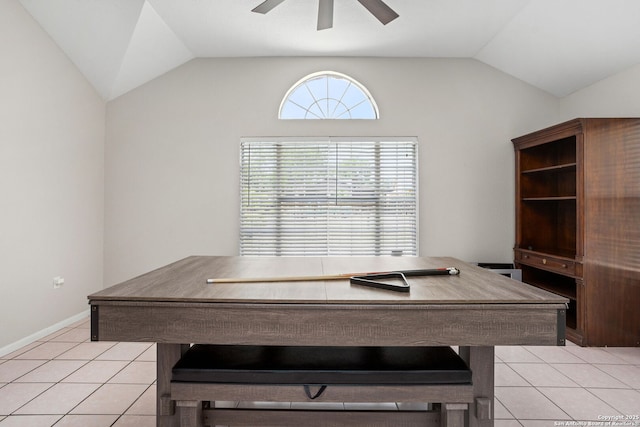 home office featuring baseboards, a ceiling fan, lofted ceiling, and light tile patterned flooring