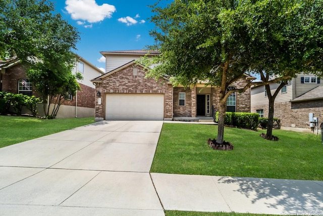 obstructed view of property with concrete driveway, brick siding, an attached garage, and a front yard