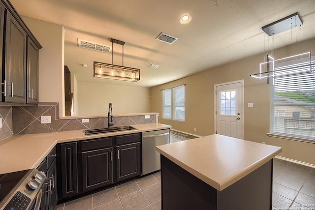 kitchen featuring a sink, stainless steel appliances, light tile patterned flooring, and visible vents