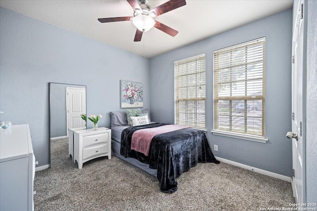 bedroom with baseboards, carpet flooring, and ceiling fan