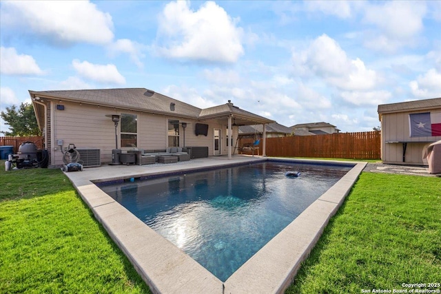 view of swimming pool with central AC unit, a fenced in pool, an outdoor hangout area, a fenced backyard, and a yard