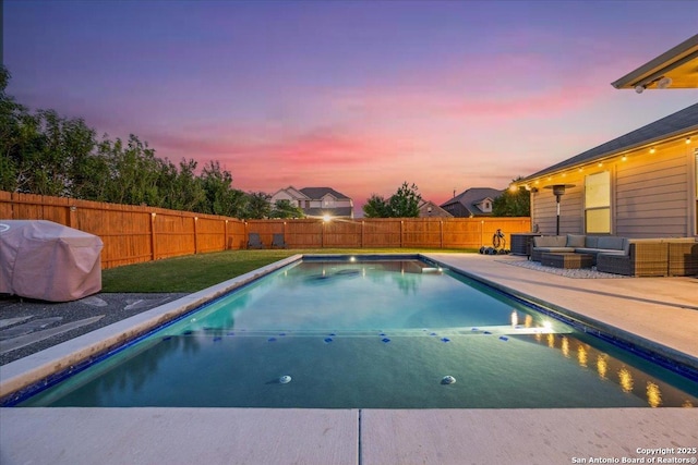 pool at dusk with an outdoor living space, a fenced backyard, a patio area, and a fenced in pool