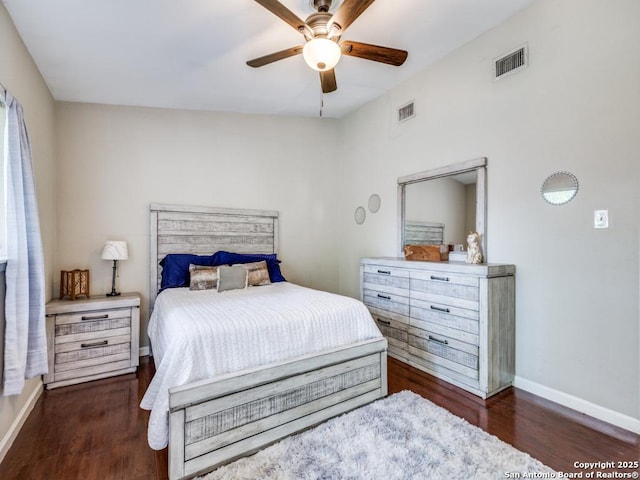 bedroom with ceiling fan, baseboards, visible vents, and wood finished floors