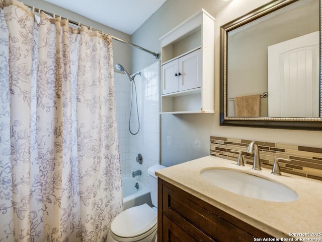 full bathroom featuring vanity, backsplash, shower / bath combination with curtain, and toilet
