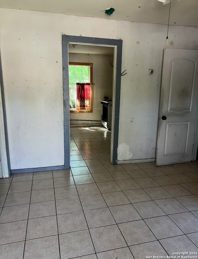 spare room with light tile patterned floors