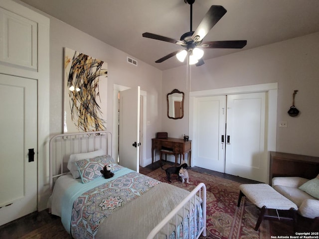 bedroom featuring ceiling fan, french doors, visible vents, a closet, and dark wood-type flooring