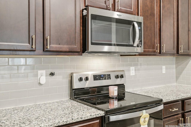 9223 Yaya, Converse, TX 78109 - kitchen with decorative backsplash, dark brown cabinetry, and stainless steel appliances