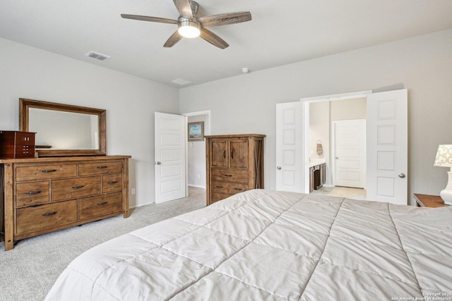 9223 Yaya, Converse, TX 78109 - bedroom featuring light colored carpet, a ceiling fan, ensuite bathroom, and visible vents