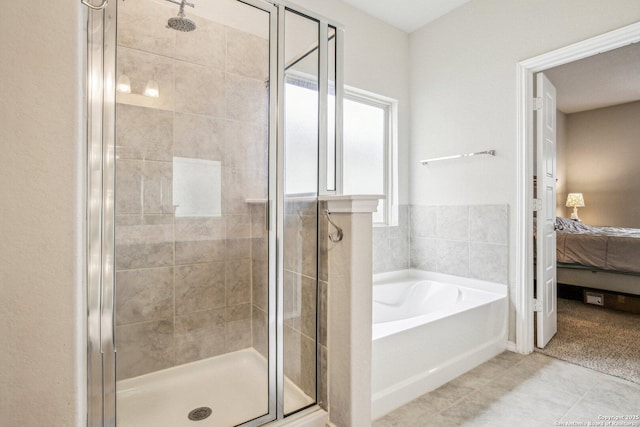 9223 Yaya, Converse, TX 78109 - ensuite bathroom with ensuite bathroom, a stall shower, and a garden tub