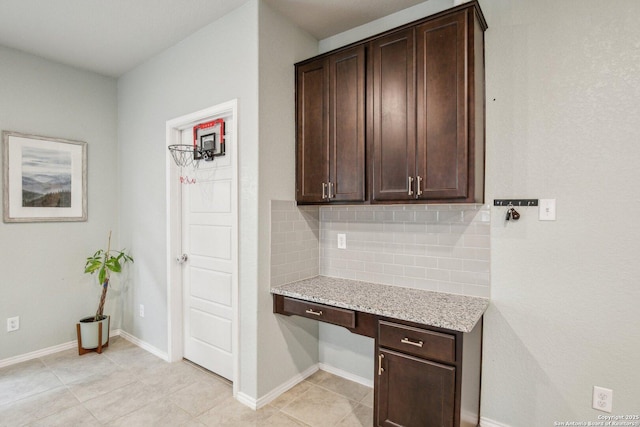 9223 Yaya, Converse, TX 78109 - unfurnished office featuring light tile patterned floors, baseboards, and built in desk