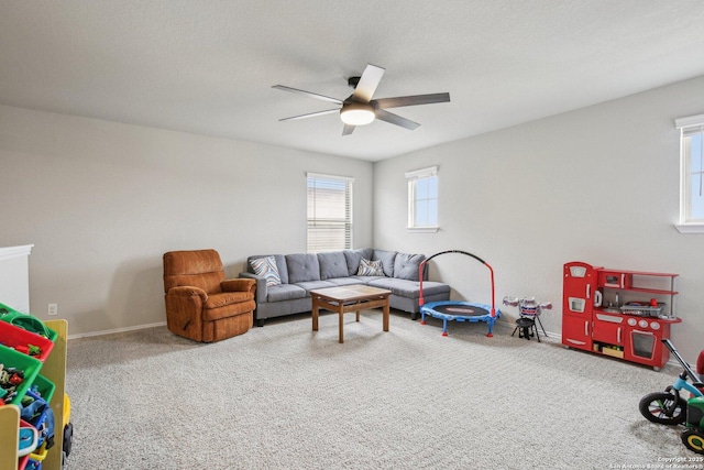 9223 Yaya, Converse, TX 78109 - living area featuring a ceiling fan, baseboards, and carpet