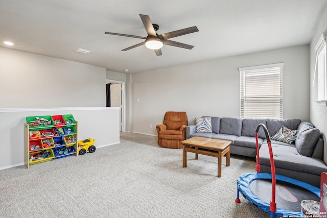 9223 Yaya, Converse, TX 78109 - living area featuring visible vents, a ceiling fan, carpet, and baseboards