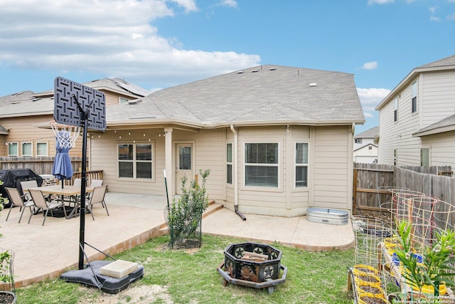 9223 Yaya, Converse, TX 78109 - rear view of house featuring fence private yard, a shingled roof, an outdoor fire pit, and a patio
