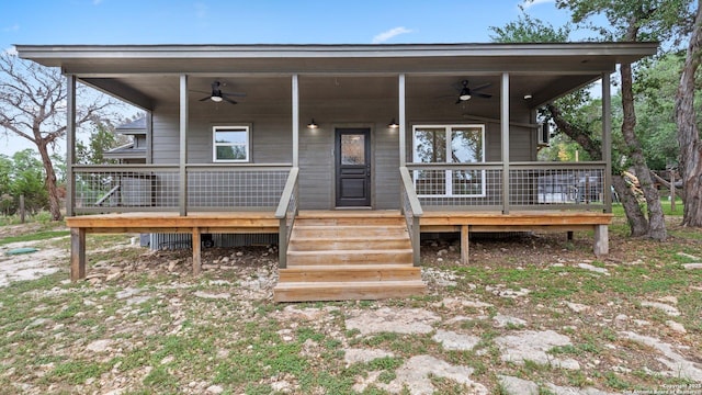exterior space featuring a ceiling fan