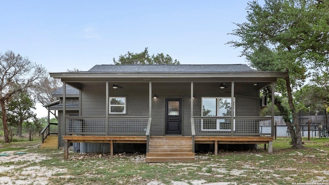 back of house with covered porch and ceiling fan