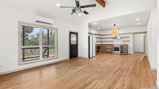 unfurnished living room featuring a ceiling fan, beamed ceiling, a wall mounted AC, and light wood-style flooring