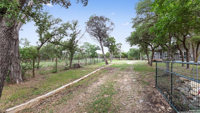 view of road with a gated entry and driveway