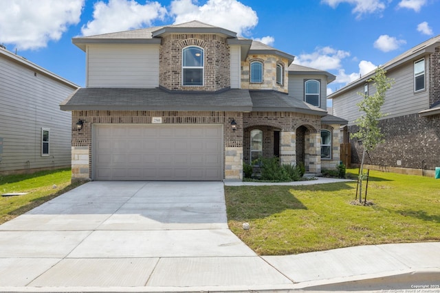 view of front of house featuring roof with shingles, an attached garage, brick siding, a front yard, and concrete driveway