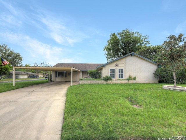 ranch-style house featuring a carport, driveway, and a front yard