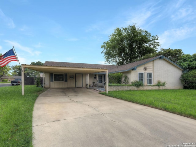 ranch-style house with a carport, driveway, a front lawn, and brick siding