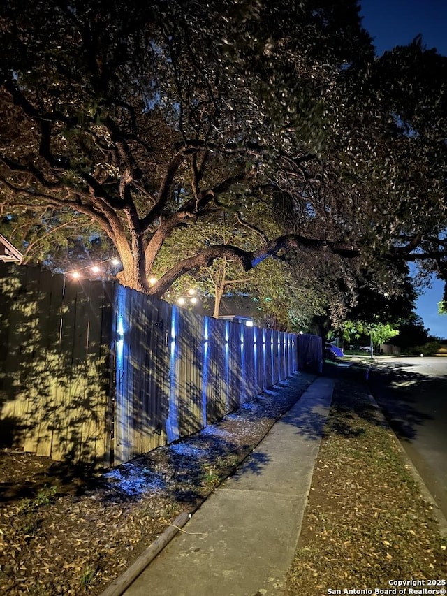view of community with fence