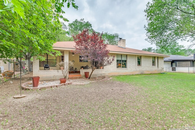 15111 Elkton, San Antonio, TX 78232 - back of property with fence, brick siding, a porch, a chimney, and a lawn