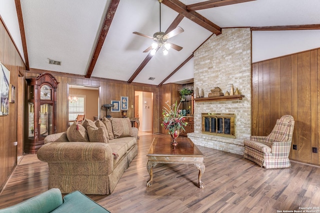 15111 Elkton, San Antonio, TX 78232 - living area featuring ceiling fan, wood walls, and wood finished floors