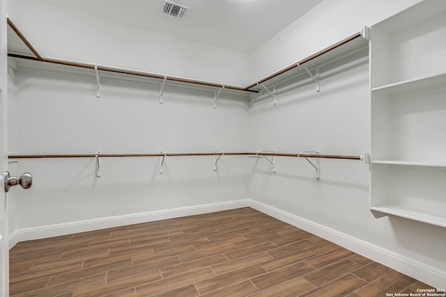 8314 Marek, San Antonio, TX 78224 - walk in closet featuring visible vents and dark wood-style flooring