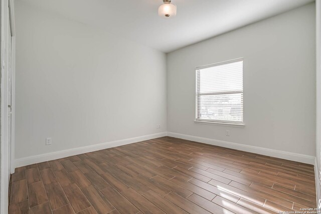 8314 Marek, San Antonio, TX 78224 - empty room featuring baseboards and dark wood-style floors