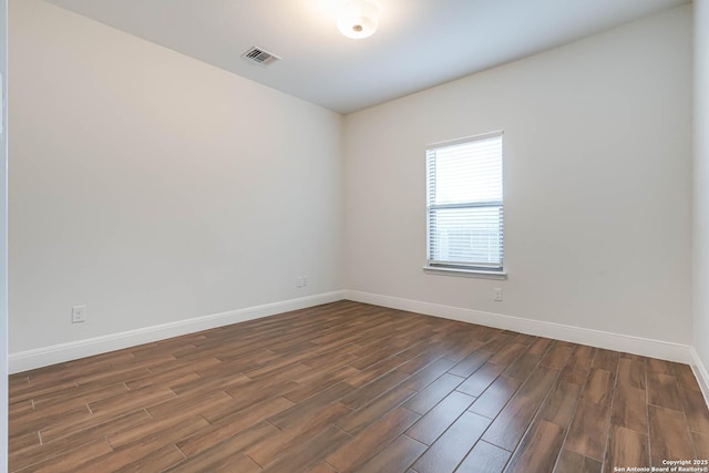 8314 Marek, San Antonio, TX 78224 - spare room with baseboards, dark wood-style flooring, and visible vents