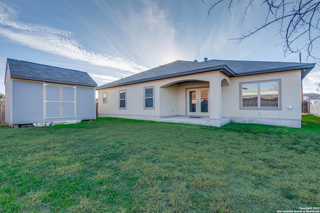 8314 Marek, San Antonio, TX 78224 - back of property featuring fence, a shed, an outbuilding, french doors, and a lawn