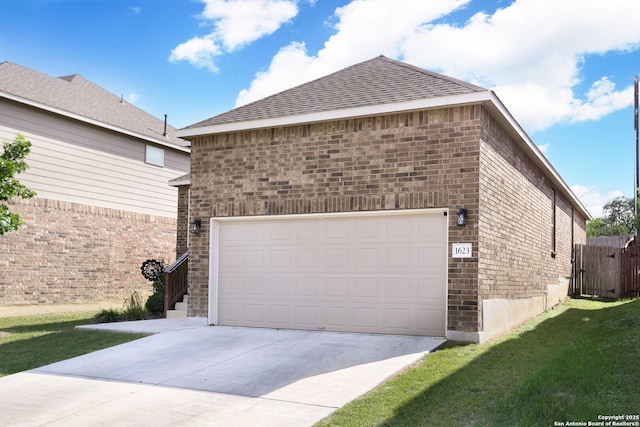 garage featuring driveway