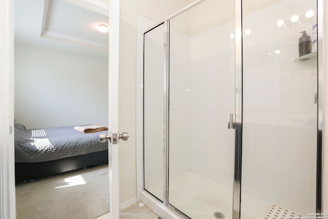 bathroom with ensuite bathroom and a stall shower