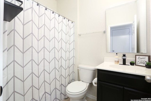 bathroom featuring toilet, a shower with curtain, and vanity