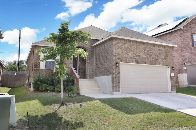 view of front of house with fence, an attached garage, a front lawn, brick siding, and driveway