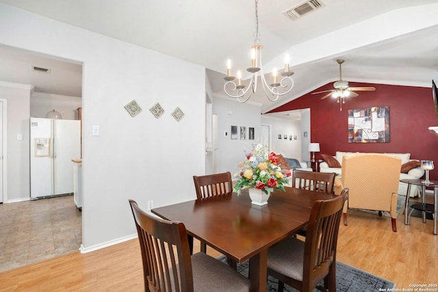 9503 Kirk Pond, San Antonio, TX 78240 - dining space with a ceiling fan, vaulted ceiling, light wood-style flooring, baseboards, and a chandelier