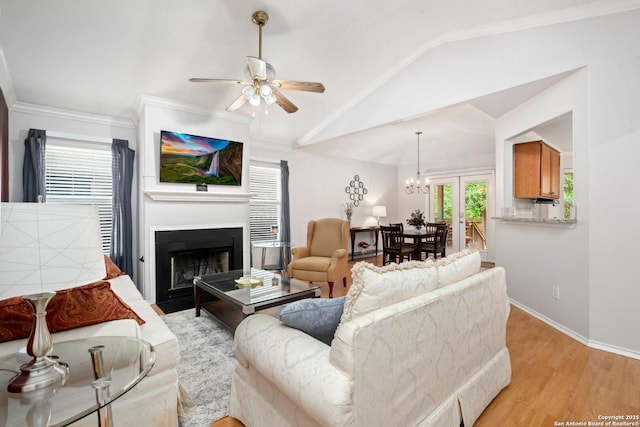 9503 Kirk Pond, San Antonio, TX 78240 - living room featuring ceiling fan, a large fireplace, light wood finished floors, vaulted ceiling, and baseboards