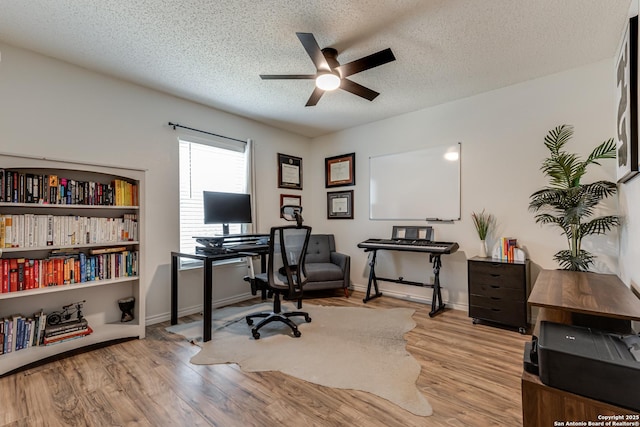 office area with baseboards, a textured ceiling, ceiling fan, and wood finished floors