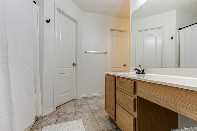 full bathroom with tile patterned flooring and vanity