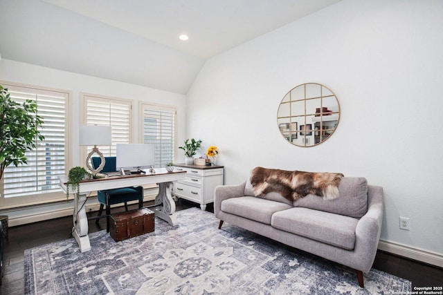 office area with wood finished floors, vaulted ceiling, and baseboards