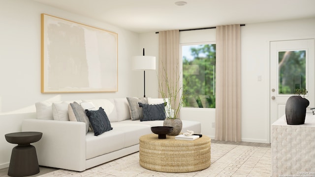 living area featuring baseboards and wood finished floors