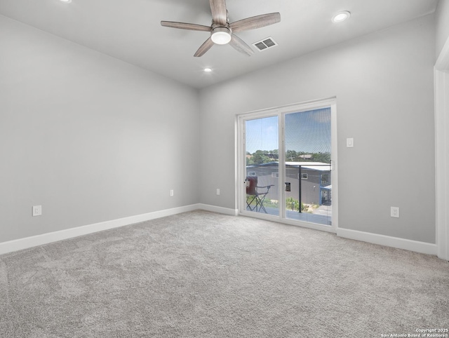 carpeted empty room with recessed lighting, ceiling fan, visible vents, and baseboards