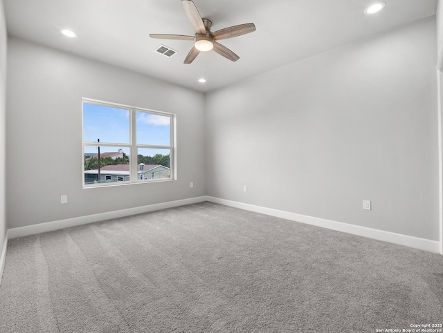 spare room with ceiling fan, recessed lighting, and visible vents