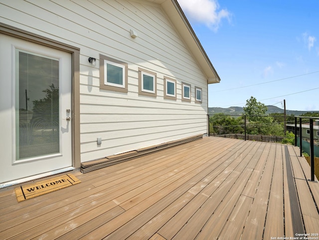 wooden deck featuring a mountain view