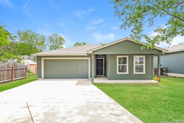 2430 Bermuda, San Antonio, TX 78222 - ranch-style home featuring fence, an attached garage, concrete driveway, and a front yard