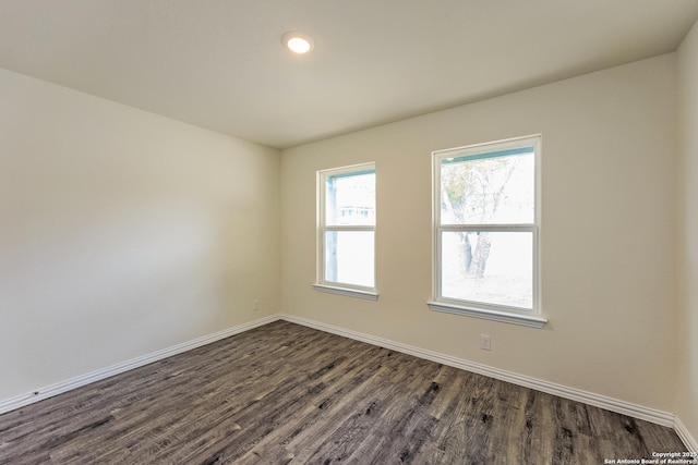 2430 Bermuda, San Antonio, TX 78222 - unfurnished room featuring baseboards, recessed lighting, and dark wood-style floors