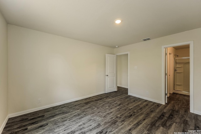 2430 Bermuda, San Antonio, TX 78222 - unfurnished bedroom featuring visible vents, dark wood finished floors, and baseboards